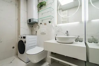 a white bathroom with a toilet and a sink at Monte Living by In Property in Ðenaši