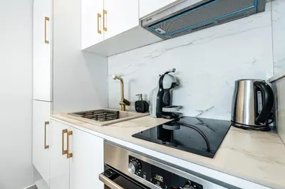 a kitchen with a sink and a stove at Przno Apartments by In Property in Pržno