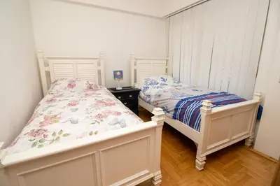 a bedroom with two twin beds in a room at APARTMENTS ANI in Ulcinj