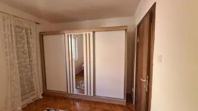 an empty room with a sliding glass door at Boka apartment in Kotor