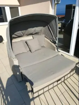 a bed sitting on the back of a boat at Bulat 1 in Budva