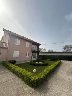 a house with a garden in front of it at SARA in Ðuranovići