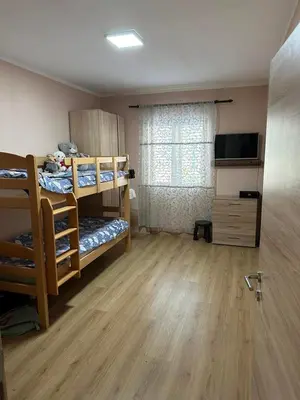 a room with two bunk beds and a window at SARA in Ðuranovići