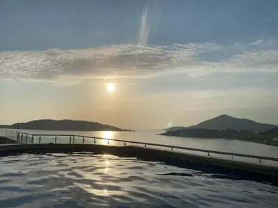 a swimming pool with a view of the water at Ponta Nova One bedroom Apartment with Sea view in Budva