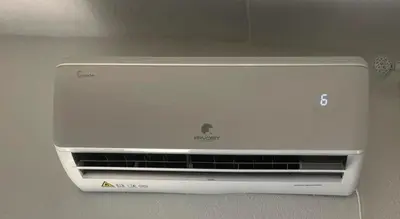 a white air conditioner sitting on top of a wall at Mara in Podgorica