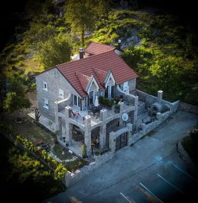 an aerial view of a house with a roof at Villagio in Virpazar