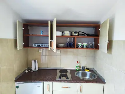 a kitchen with a sink and a counter top at Glory Suites in Budva