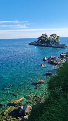a view of the ocean with rocks in the water at La Vista Apartment in Petrovac na Moru