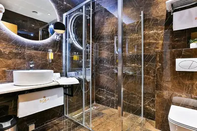 a bathroom with a shower and a sink at Hotel Boka in Kotor