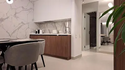 a kitchen and dining room with a table and chairs at Vista Premium Apartment in Kotor