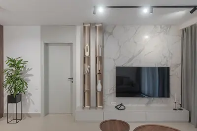 a living room with a television on a wall at Vista Premium Apartment in Kotor