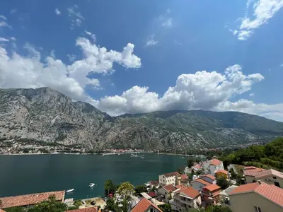 a view of a lake with mountains in the background at Vista Premium Apartment in Kotor
