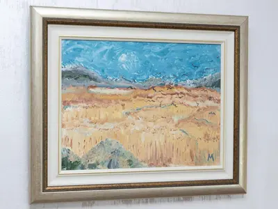 a framed picture of a painting on a wall at Apartment Kosta in Podgorica