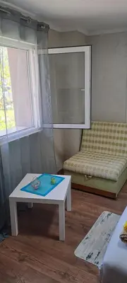 a living room with a table and a couch at Studio Kaća 2 in Cetinje
