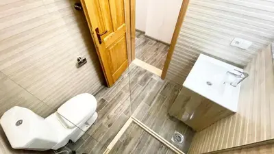 a bathroom with a toilet and a sink at Guest House Bonaca in Ulcinj