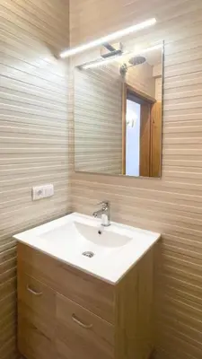 a bathroom with a sink and a mirror at Guest House Bonaca in Ulcinj