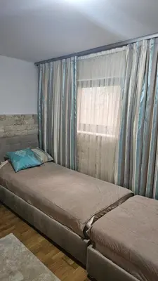 a bedroom with two beds and a window at APARTMAN NIKA BUDVA-PRZNO in Budva