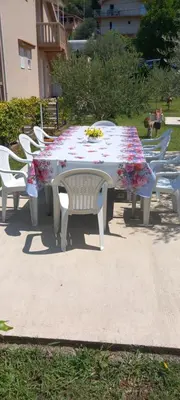 a table with a floral table cloth on it at Rada in Kavač