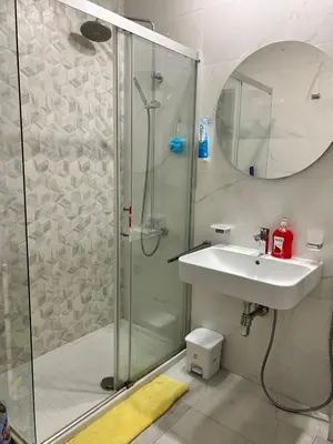 a bathroom with a shower and a sink at Comfort Central Point apartment in Podgorica
