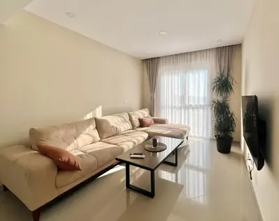 a living room with a couch and a coffee table at Danver Apartment in Bar