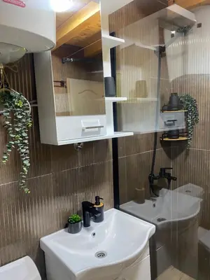 a bathroom with a sink and a toilet and a mirror at Skadar Lake House Nature Nest in Virpazar