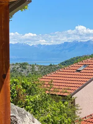 a view of a roof with mountains in the background at Skadar Lake House Nature Nest in Virpazar