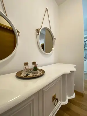 a bathroom with a white counter and a mirror at Lux Apartment Meecoon Rafailovići in Rafailovici