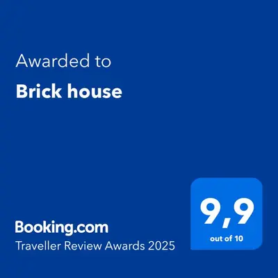 a screenshot of a black house with the text upgraded to brick house at Brick house in Cetinje