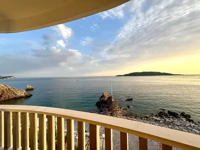 a view of the ocean from a balcony at Net in Rafailovici