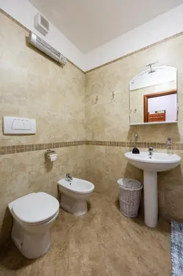 a bathroom with a toilet and a sink at Net in Rafailovici