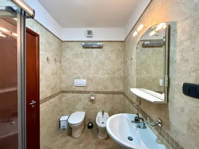 a bathroom with a sink and a toilet at Net in Rafailovici