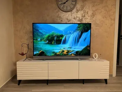a flat screen tv sitting on a dresser at Petar Apartment in Podgorica