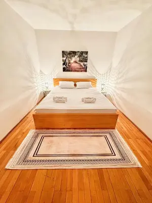 a bedroom with a bed in a room at Mia Apartment in Budva