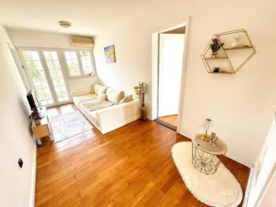 a living room with a couch and a table at Mia Apartment in Budva