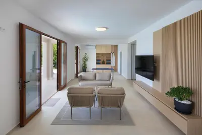 a living room with a couch and a tv at Villa Fotinia in Budva