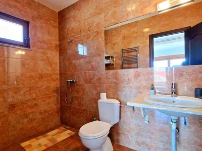 a bathroom with a toilet and a sink at Luxury Villa Pontus in Kotor