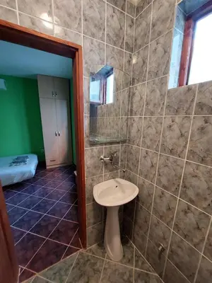 a bathroom with a toilet and a sink in it at PEKOVIĆ in Bar