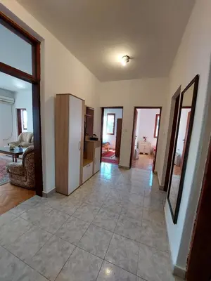 a large living room with a large tiled floor at PEKOVIĆ in Bar
