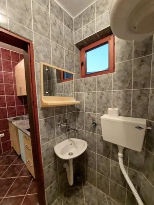 a bathroom with a sink and a mirror at PEKOVIĆ in Bar
