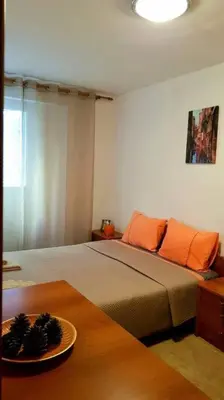 a bedroom with a bed and a plate on a table at Apartment with a garden Petrovac in Petrovac na Moru