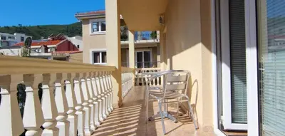 a chair sitting on the balcony of a building at MICIC CENTRE in Budva