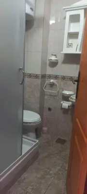 a bathroom with a toilet and two sinks at MICIC CENTRE in Budva