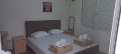 a bedroom with a bed with two towels on it at MICIC CENTRE in Budva