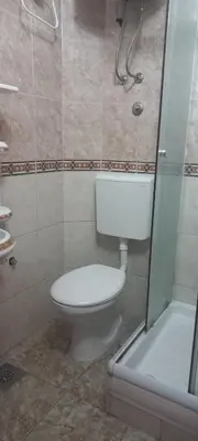 a bathroom with a toilet and a shower at MICIC CENTRE in Budva