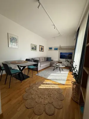 a living room with a couch and a table at LUX Apartment Secret Residence in Becici