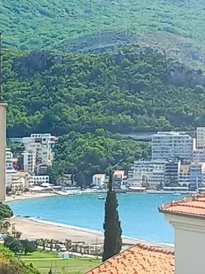 a view of a beach and a city at LUX Apartment Secret Residence in Becici