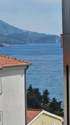 a view of a large body of water from a building at LUX Apartment Secret Residence in Becici