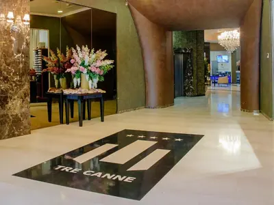 a lobby with vases of flowers on a table at Tecasi Lux Apartments in Budva