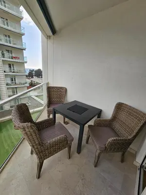 a balcony with a table and two chairs and a table at Tecasi Lux Apartments in Budva