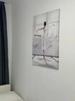 a painting of a ballet dancer on a wall at Family One bedroom apartment Marijana in Budva
